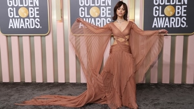 Jenna Ortega also went for the crisscross look in a breezy, pleated copper colour. It was Gucci paired with necklaces by Tiffany &amp; Co.&nbsp; (REUTERS)
