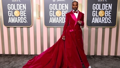 Billy Porter makes a head-turning statement at the 80th Annual Golden Globe Awards as he chooses a red and hot pink-hued tuxedo gown styled with shimmering jewellery and a bow tie.&nbsp; (REUTERS)