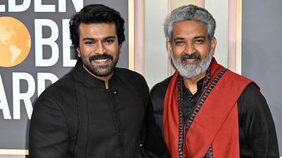 Ram Charan, who also wore black, posed with SS Rajamouli on the red carpet. Ram Charan, who also wore black, posed with SS Rajamouli on the red carpet.