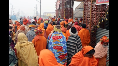 Sadhus and devotees stand outside of a camp for food distribution during the Magh Mela, in Prayagraj on Wednesday. (ANI Photo) Sadhus and devotees stand outside of a camp for food distribution during the Magh Mela, in Prayagraj on Wednesday. (ANI Photo)