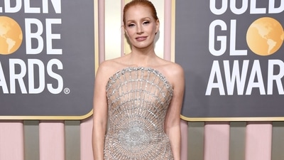 Jessica Chastain, nominated for her portrayal of country music star Tammy Wynette in George and Tammy sparkled in an intricate silvery spider web patterned Oscar de la Renta gown.&nbsp; (Getty Images via AFP)