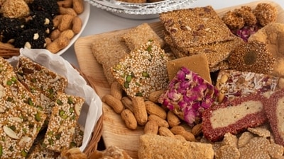 Some of the traditional foods that are consumed on Lohri include sarson ka saag, makki ki roti, gajak, til-gur laddoos, gajrela, popcorns, peanuts, rewri, and gur. These foods are not only delicious but also have significance in the festival. (Unsplash) Some of the traditional foods that are consumed on Lohri include sarson ka saag, makki ki roti, gajak, til-gur laddoos, gajrela, popcorns, peanuts, rewri, and gur. These foods are not only delicious but also have significance in the festival. (Unsplash)