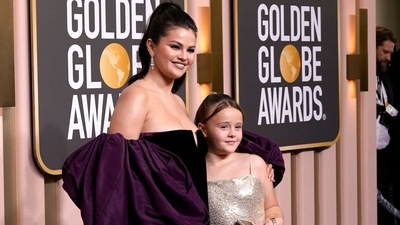 Selena Gomez, left, and Gracie Elliott Teefey arrive at the 80th annual Golden Globe Awards. (Invision) Selena Gomez, left, and Gracie Elliott Teefey arrive at the 80th annual Golden Globe Awards. (Invision)