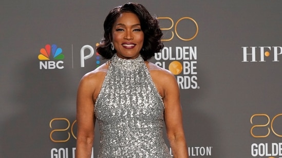 Angela Bassett, winner of the award for best performance by an actress in a supporting role in any motion picture for "Black Panther: Wakanda Forever," poses in the press room at the 80th annual Golden Globe Awards at the Beverly Hilton Hotel. She wore a magnificent silver embellished gown to the awards night.(Invision)