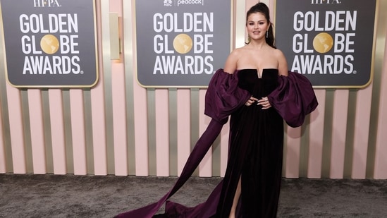 Selena Gomez attends the 80th Annual Golden Globe Awards in a strapless plunging-neck gown featuring statement puffy sleeves and floor-sweeping train. Her stylish hairdo and minimal makeup wins the day.&nbsp;(REUTERS)