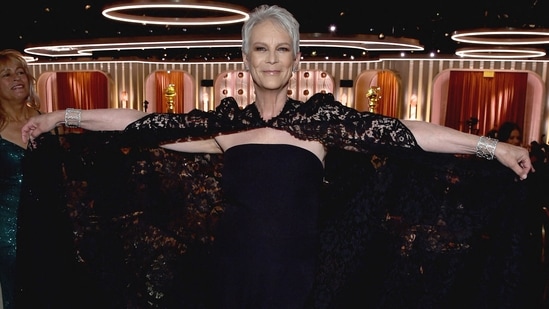 Jamie Lee Curtis, a nominee for Everything Everywhere All at Once, donned a black Valentino pantsuit with a flowing lace cape.&nbsp;(REUTERS)