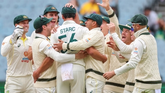 Australian players celebrate with Australia's Mitchell Starc, center, after Starc got the wicket of South Africa's Sarel Erwee during the second cricket test between South Africa and Australia at the Melbourne Cricket Ground, Australia, Thursday, Dec. 29, 2022. (AP Photo/Asanka Brendon Ratnayake)(AP)
