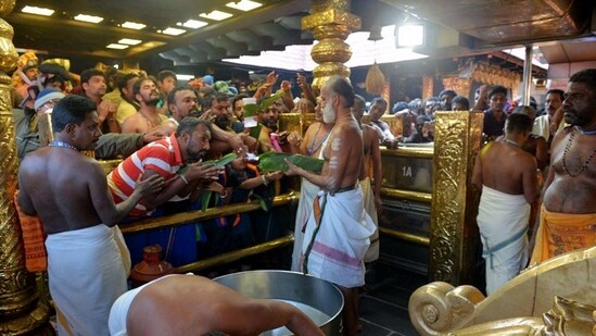 Devotees pay obeisance at Sabarimala Temple . (ANI pic service)