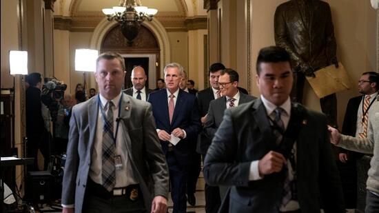 House Speaker Kevin McCarthy (R-CA) (centre) walks to his office from the House floor at the US Capitol in Washington, DC. (REUTERS)