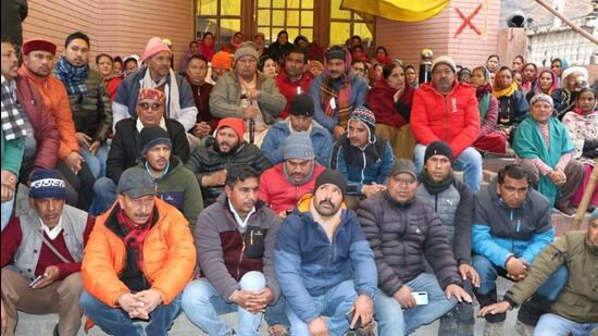 Locals staging a protest outside hotel Malari Inn against its demolition on Wednesday. (Photo by Rajiv Kala)