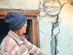 A man shows cracks in his house at Joshimath. (PTI) A man shows cracks in his house at Joshimath. (PTI)