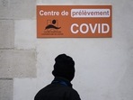 A man passes in front of a Covid 19 laboratory at the Saint-Jacques CHU (Centre Hospitalier Universitaire) in Nantes, western France. Long Covid symptoms fading for mild coronavirus infections, says new study (Photo by LOIC VENANCE / AFP) A man passes in front of a Covid 19 laboratory at the Saint-Jacques CHU (Centre Hospitalier Universitaire) in Nantes, western France. Long Covid symptoms fading for mild coronavirus infections, says new study (Photo by LOIC VENANCE / AFP)