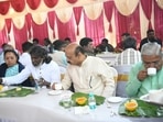 Bommai having breakfast with crematorium workers on Wednesday. Bommai having breakfast with crematorium workers on Wednesday.