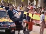 A youth tries to hand a garland to Prime Minister Narendra Modi while allegedly breaching his security cover during his roadshow in Hubballi on Thursday, (PTI) A youth tries to hand a garland to Prime Minister Narendra Modi while allegedly breaching his security cover during his roadshow in Hubballi on Thursday, (PTI)