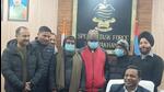 Special task force (STF) of Uttarakhand police with the three accused arrested in fake BAMS degrees case. (HT Photo)