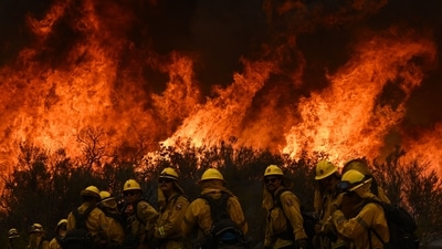 Firefighters during rescue operations at the Fairview wildfire near Hemet, California, on September 8, 2022. The last eight years were the warmest on record even with the cooling influence of a La Nina weather pattern since 2020, the European Union's climate monitoring service reported on January 10, 2023. (Patrick T. Fallon / AFP) Firefighters during rescue operations at the Fairview wildfire near Hemet, California, on September 8, 2022. The last eight years were the warmest on record even with the cooling influence of a La Nina weather pattern since 2020, the European Union's climate monitoring service reported on January 10, 2023. (Patrick T. Fallon / AFP)