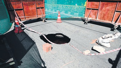 A motorcyclist was injured after sinkhole appeared on Brigade Road in Bengaluru, where metro work is underway, officials said. (HT Photo) A motorcyclist was injured after sinkhole appeared on Brigade Road in Bengaluru, where metro work is underway, officials said. (HT Photo)