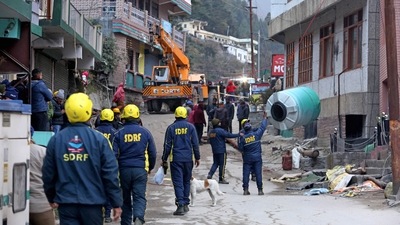 NDRF and SDRF personnel deployed near the damaged hotels that were demolished after coming under the red zone due to recent land subsidence at Joshimath, in Chamoli on Thursday. (ANI) NDRF and SDRF personnel deployed near the damaged hotels that were demolished after coming under the red zone due to recent land subsidence at Joshimath, in Chamoli on Thursday. (ANI)