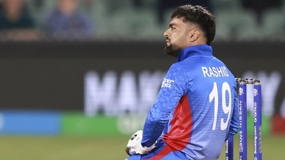 Afghanistan's Rashid Khan reacts while batting during the T20 World Cup cricket match between Australia and Afghanistan (AP) Afghanistan's Rashid Khan reacts while batting during the T20 World Cup cricket match between Australia and Afghanistan (AP)
