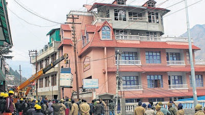 Demolition of a hotel underway in Joshimath on Thursday. (PTI) Demolition of a hotel underway in Joshimath on Thursday. (PTI)