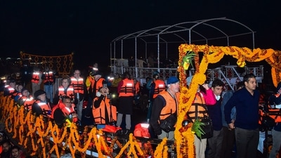 Tourists of Luxury Cruise MV Ganga Vilas reach to attend the Ganga Aarti at Dashashwamedh Ghat, in Varanasi on Wednesday.&nbsp; (PTI)