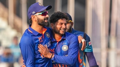 Indian bowler Kuldeep Yadav with teammate Virat Kohli celebrates the wicket of Sri Lanka's batter Charith Asalanka (PTI) Indian bowler Kuldeep Yadav with teammate Virat Kohli celebrates the wicket of Sri Lanka's batter Charith Asalanka (PTI)