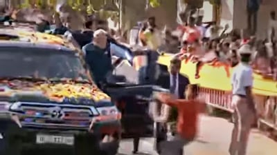 A youth tries to hand a garland to Prime Minister Narendra Modi while allegedly breaching his security cover during his roadshow in Hubballi on Thursday, (PTI) A youth tries to hand a garland to Prime Minister Narendra Modi while allegedly breaching his security cover during his roadshow in Hubballi on Thursday, (PTI)