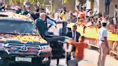 Screen grab of the teenager (encircled) trying to garland Prime Minister Narendra Modi in Hubballi on Thursday. Screen grab of the teenager (encircled) trying to garland Prime Minister Narendra Modi in Hubballi on Thursday.
