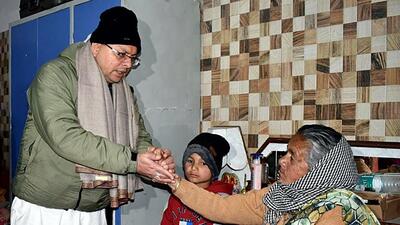 Uttarakhand chief minister Pushkar Singh Dhami met the affected families of Joshimath and assured them of all possible help from the government. (ANI Photo) Uttarakhand chief minister Pushkar Singh Dhami met the affected families of Joshimath and assured them of all possible help from the government. (ANI Photo)