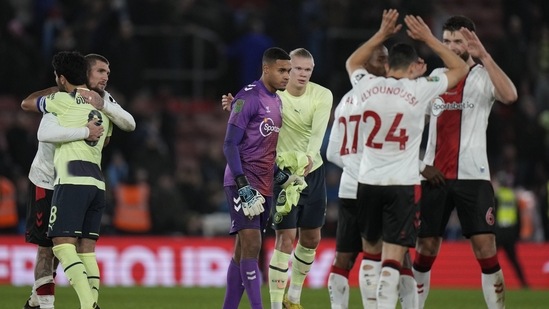 Players greet each other at the end of the English League Cup quarter final soccer match between Southampton and Manchester City at St Mary's stadium in Southampton, England, Wednesday, Jan. 11, 2023. Southampton won 2-0. (AP Photo/Alastair Grant)(AP)
