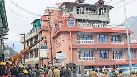 Demolition of a hotel underway in Joshimath on Thursday. (PTI)