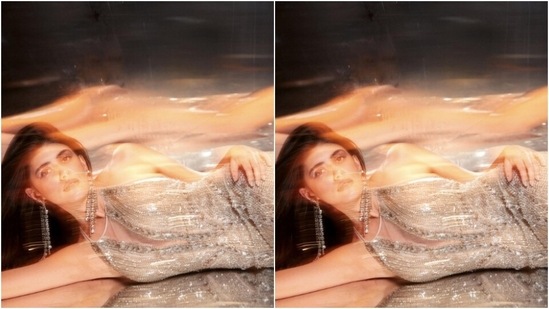 Sanjana looked perfect in the sleeveless gown featuring a closed neckline with translucent details, and sequin work throughout. The bodycon gown hugged her shape and showed off her curves perfectly.&nbsp;(Instagram/@sanjanasanghi96)