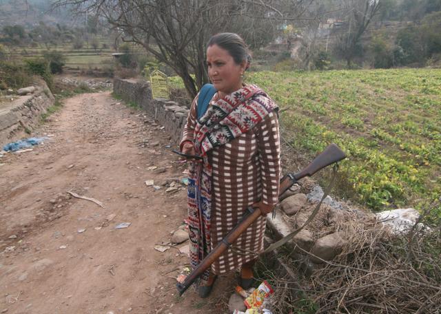 A woman VDC member with a .303 rifle outside the Baljarallan police post in Rajouri. (Photo: Imran) A woman VDC member with a .303 rifle outside the Baljarallan police post in Rajouri. (Photo: Imran)