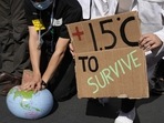Demonstrators pretend to resuscitate the Earth while advocating for the 1.5 degree warming goal to survive at the COP27 U.N. Climate Summit.(AP file) Demonstrators pretend to resuscitate the Earth while advocating for the 1.5 degree warming goal to survive at the COP27 U.N. Climate Summit.(AP file)