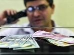 Currency seen at a forex bureau counter in New Delhi. Currency seen at a forex bureau counter in New Delhi.
