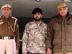  Abhinav Prakash, 24, with Delhi Police personnel.