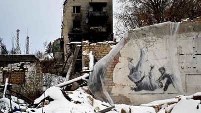 A piece by British street artist Banksy, covered with plastic, spotted in the small town of Borodyanka, some 60 km from the Ukrainian capital of Kyiv on January 12, 2023. Thousands of "hostile" web attacks launched from Russian IP addresses targeted an online auction of prints by British graffiti artist Banksy in aid of Ukraine on January 10, AFP reported. (Sergei Supinsky / AFP) A piece by British street artist Banksy, covered with plastic, spotted in the small town of Borodyanka, some 60 km from the Ukrainian capital of Kyiv on January 12, 2023. Thousands of "hostile" web attacks launched from Russian IP addresses targeted an online auction of prints by British graffiti artist Banksy in aid of Ukraine on January 10, AFP reported. (Sergei Supinsky / AFP)