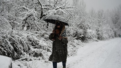 A person walks on snow-clad road in Srinagar. (Waseem Andrabi/HT photo) A person walks on snow-clad road in Srinagar. (Waseem Andrabi/HT photo)
