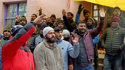 Locals shout slogans to protest against NTPC and the state government over cracks widening due to land subsidence at Joshimath, in Chamoli on Wednesday. Locals shout slogans to protest against NTPC and the state government over cracks widening due to land subsidence at Joshimath, in Chamoli on Wednesday.