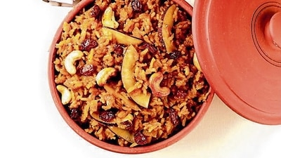 The dessert version, Chakkara Pongal (chakkara is Tamil for jaggery), is flavoured with jaggery and elaichi, topped with ghee-roasted cashews and raisins. (Shutterstock) The dessert version, Chakkara Pongal (chakkara is Tamil for jaggery), is flavoured with jaggery and elaichi, topped with ghee-roasted cashews and raisins. (Shutterstock)