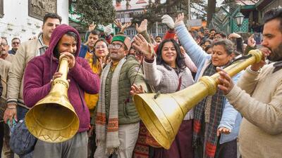 Employees celebrate after the state announced implementation of Old Pension Scheme, in Shimla. (PTI) Employees celebrate after the state announced implementation of Old Pension Scheme, in Shimla. (PTI)