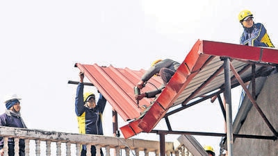 Malari Inn Hotel being dismantled by SDRF personnel due to the continuous land subsidence, in Joshimath on Friday. (ANI) Malari Inn Hotel being dismantled by SDRF personnel due to the continuous land subsidence, in Joshimath on Friday. (ANI)