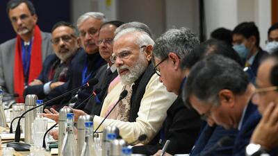 Prime Minister Narendra Modi interacting with the noted economists and experts, at NITI Aayog, in New Delhi on Friday. (ANI/PIB)