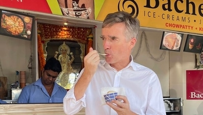 Britain's High Commissioner to India Alex Ellis eating an ice cream in Mumbai on Thursday. (@AlexWEllis/ Twitter)