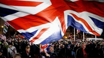 A man waves a British flag on Brexit day in London. (File) (REUTERS) A man waves a British flag on Brexit day in London. (File) (REUTERS)