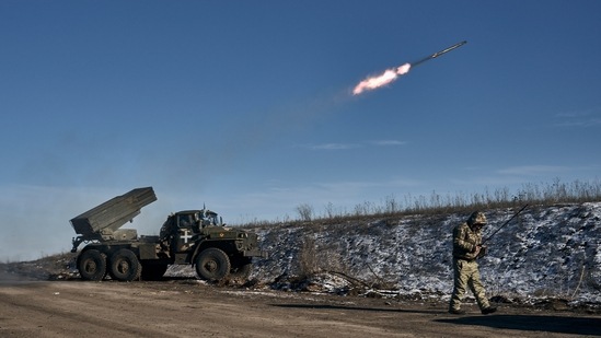 A Ukrainian army Grad multiple rocket launcher is seen firing rockets to Russian positions in the frontline near Soledar, Donetsk region, on January 11. Russia's defense ministry said on January 13 that its forces have captured the salt-mining town of Soledar, the focus of a bloody battle between Russian and Ukrainian forces for months. (Libkos / AP )