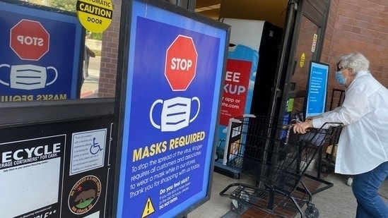 Covid In US: People shop at a grocery store enforcing the wearing of masks in Los Angeles.(AFP File)