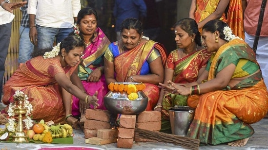 Devotees cook traditional sweet dishes on the occasion of Pongal festival. 