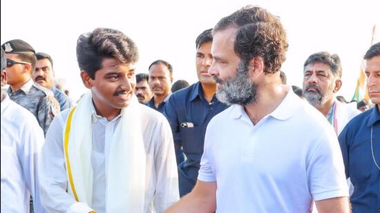 Krushna Tawale from Maharashtra’s Osmanabad with Rahul Gandhi during the initial days of Bharat Jodo Yatra. (HT Photo)