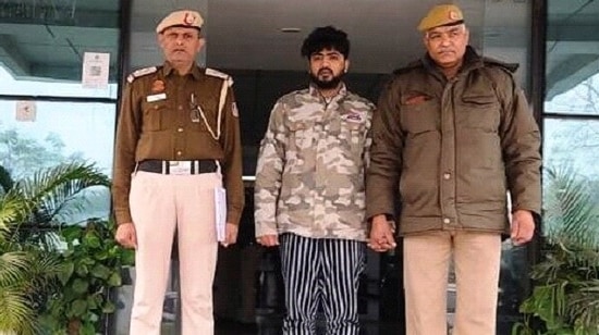  Abhinav Prakash, 24, with Delhi Police personnel.